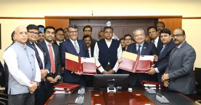 Arvind Singh, chairman, AAI (middle) at the signing ceremony between B.K. Mehrotra of AAI (Right) and Behnad Zandi of Airports Adani Enterprise (Left).
