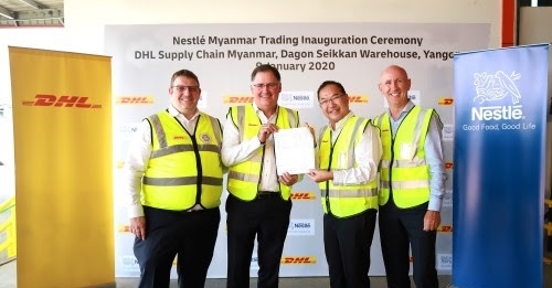 (From Left to Right) Kevin Burrell, CEO, DHL Supply Chain, Thailand Cluster and Terry Ryan, CEO, DHL Supply Chain Asia Pacific hand the first invoice to Victor Seah, CEO, Nestl Indochina and Stephen Knight, country manager of Nestl Myanmar at DHL Supply Chain Myanmar, Dagon Seikkan Warehouse, Yangon.