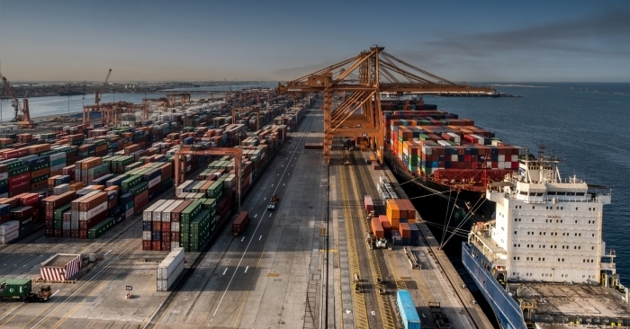 The port operator handled 33.9 million TEU (twenty-foot equivalent units) in the first half.