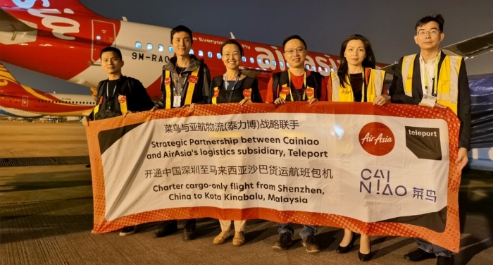 (L-R) Teleport China sales manager Archie Chen, Teleport China operation lead Simon Chen%uFF0CTeleport China country head Ying Li, director for Tmall export line haul logistics at Cainiao Kenny Wu, Airasia CEO of Hong Kong and Macau Celia Lao and AirAsia head of Airport and connectivity department of Hong Kong and Macau Ricky Chan with the AirAsia cargo-only flight that departed from Shenzhen to Kota Kinabalu on 11 November 2020.