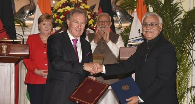 Exchanging the JDI on Green Urban Mobility between Norbert Barthle, Parliamentary State Secretary, Ministry for Economic Cooperation and Development and Durga Shankar Mishra, Secretary, MoHUA in the presence of German Chancellor Angela Merkel and Prime Minister Narendra Modi.